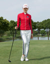 Women's padded pants with navy stripe trims, in white.