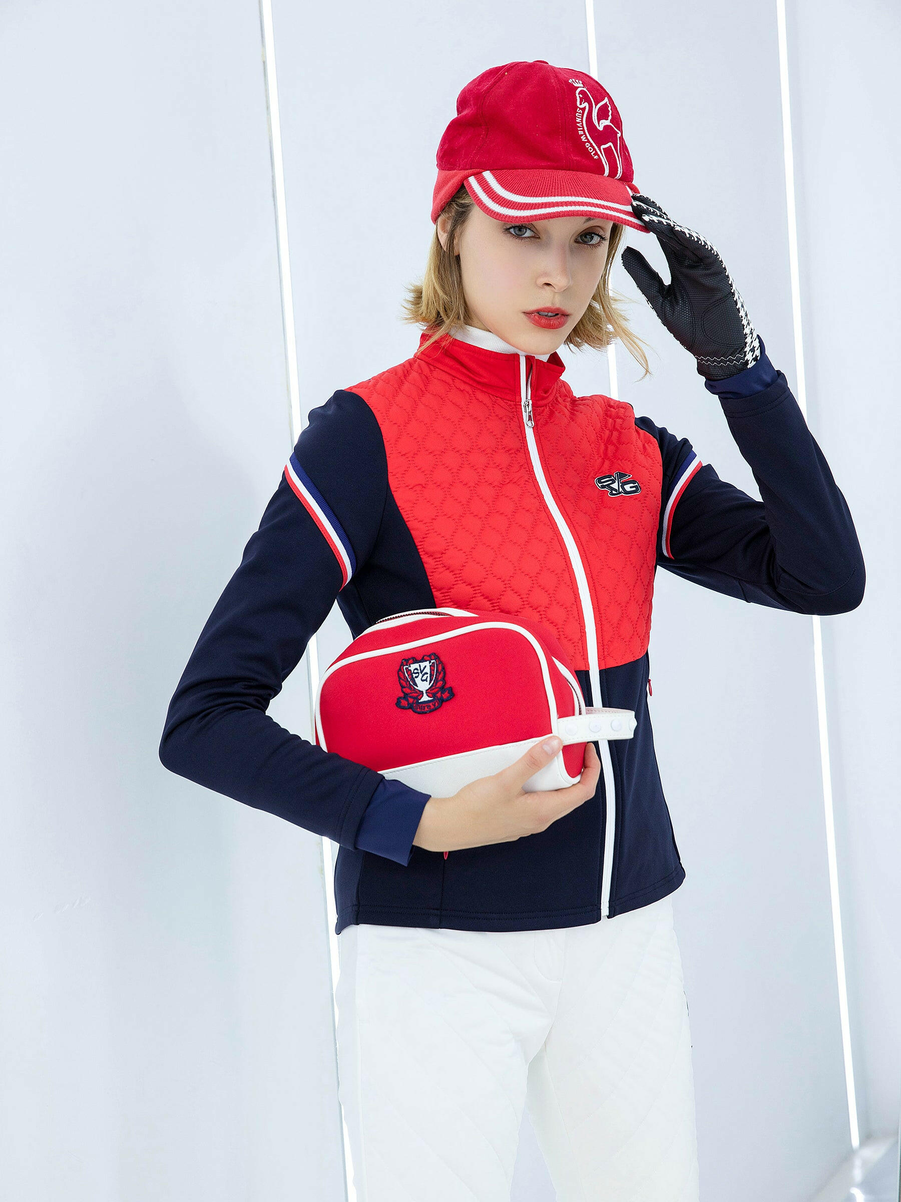 Women's padded zip-up jacket, in navy and red color blocking.