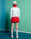 Women's A-line skort with pleated hem, in red.