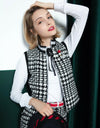 Women's zip-up tweed vest with padding, in black and white color blocking.