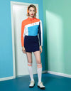 Women's long-sleeve top, in orange, white and blue color blocking.