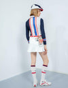 Women's long sleeve polo, in white and navy color blocking, with phoenix print, red and blue stripe trims.