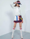 Women's long sleeve polo, in white, with folded chiffon decoration, red and navy stripe trims.
