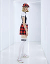 Women's short sleeve polo, in black and white color blocking.
