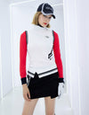 Women's knit vest with stand collar, in white and black stripe trims.