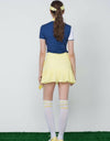 Women's yellow skirt, with pleated hem.