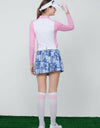 Women's skort,  in blue, cycling print, with pink stripes on the side.