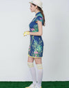 Women's navy mid-length cheongsam, with yellow pleated lining, in floral print.