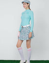 Women's green long sleeve layering top, mock neck, floral print. 