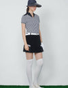 Women's short sleeve polo, with stand collar, in black and white stripes.