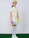 Girl's short sleeve polo, in light yellow and putting print.