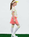 Girl's green short sleeve polo with color-blocking collar, in cat print.