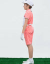 Boy's short sleeve polo, with black trim, orange and white color blocking.