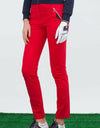 Women's slim pants with zipped pockets, in red.