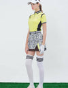 Women's A-Line skirt, with mesh lining, yellow color insert, and letter print.