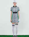 Women's mid-length golf dress with green slimming sides, white and black letter print, mesh waist band.