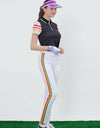 Women's short sleeve polo with zipped collar, in black, rainbow stripes on sleeves.