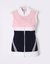 Women's knitted vest with stand collar, in pink and navy color blocking.