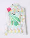 Women's long sleeve layer tee with zipped stand collar, in light green tropical print.