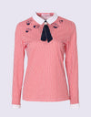 Women's long sleeve polo with removable necktie, in red stripe and unbrella print.