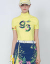 Women's short sleeve layering top with mock neck, in yellow, floral print. 