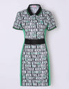 Women's mid-length golf dress with green slimming sides, white and black letter print, mesh waist band.