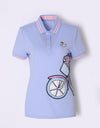Women's blue short sleeve polo, with bicycle decorational patch.