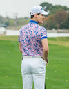 Men's short sleeve polo, with blue stripe trims and all-over floral print, in pink.