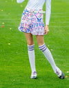 Women's A-line skirt with pleated hem, in pink and colorful butterfly print.